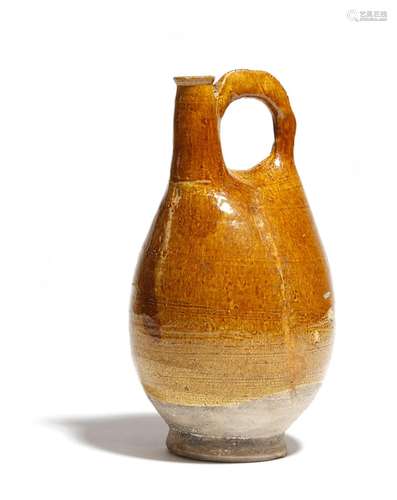 A Chinese ochre glazed pottery pilgrim flask, Liao Dynasty, 23.5cm high.Provenance: Christie's South