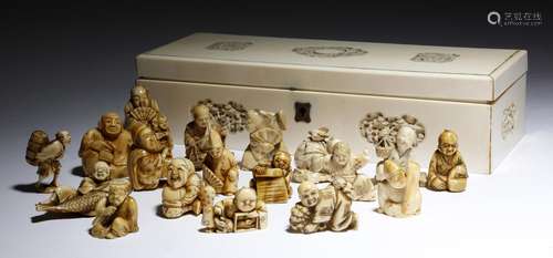 λ A collection of eighteen Japanese netsukes and carvings, ivory, marine ivory and bone, all of