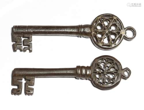 Two 16th century Italian Venetian iron keys, each with a hexafoil Gothic pierced bow, and a ring for