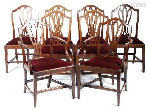 A set of eight George III mahogany dining chairs, each with a serpentine top rail, above a pierced