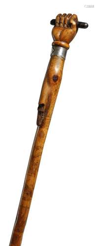 A Victorian folk art penwork decorated walking cane, with a clenched fist handle, with a silver