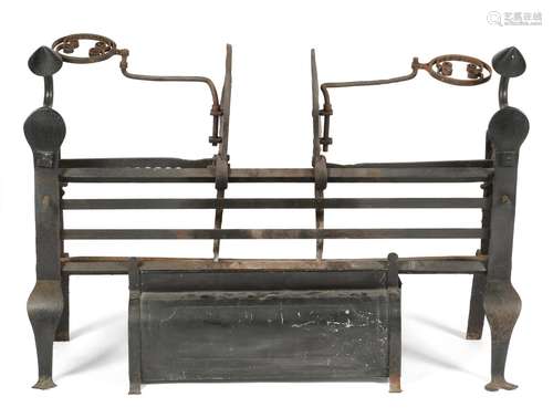 An 18th century cast iron fire-grate, with a railed front and with adjustable pot hook arms, on