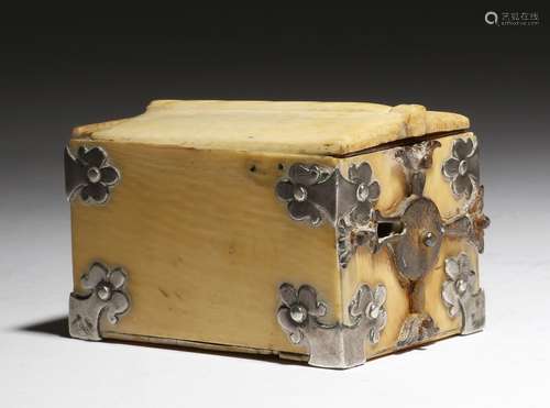 λ A small ivory casket, with silver foliate mounts, a sliding cover and an iron lock, 16th / 17th