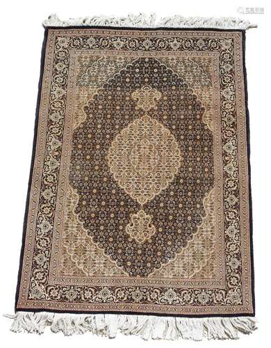 A modern rug, North West Persia, possibly Tabriz, with a central medallion, 150 x 104cm.