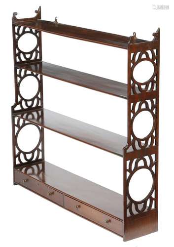 A George III mahogany hanging wall shelf, with pierced fretwork ends, the base fitted with two