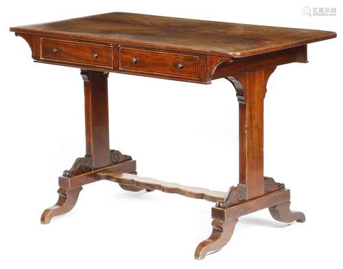 An early 19th century mahogany writing table, inlaid with boxwood stringing, the quarter veneered