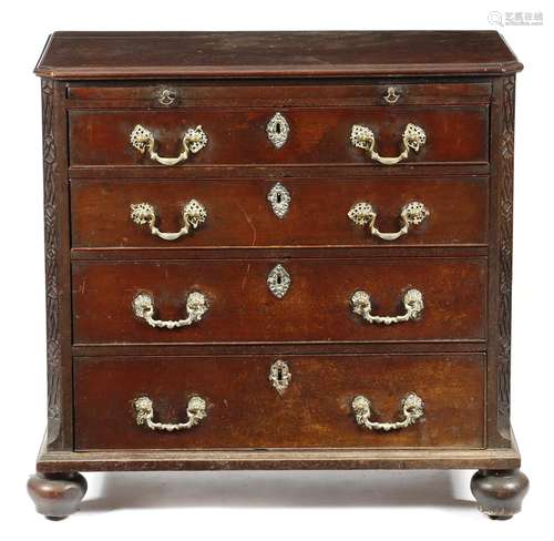 A George III mahogany chest, the top with a moulded edge, above a brushing slide and four long