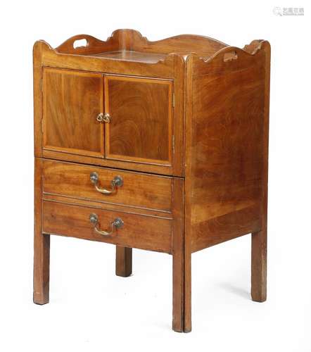 A George III mahogany tray-top bedside commode, the shaped gallery pierced with a pair of handgrips,