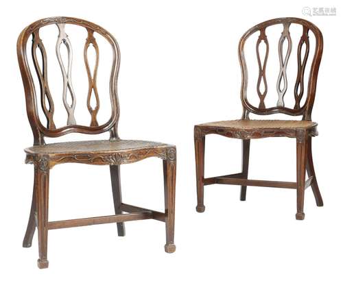 A pair of George III mahogany side chairs in French Hepplewhite style, each with a cartouche