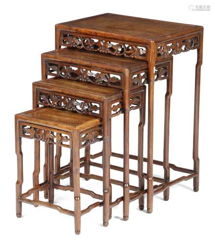 A quartetto nest of Chinese padouk occasional tables, each with a pierced frieze carved with a