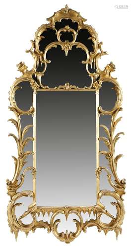 A Victorian giltwood wall mirror in Chippendale style, with a central rectangular bevelled plate,