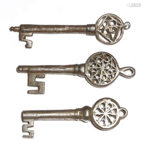 Three 16th century Italian Venetian iron keys, each with a pierced Gothic bow with a ring for