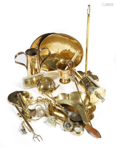 A collection of brass ware, including: a spoon with a horn bowl, a pair of candle snuffers with