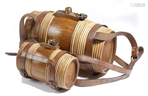 Two oak and wicker bound portable whiskey barrels, one quart and four quarts, with leather