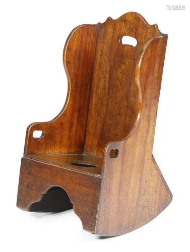 A fruitwood child's rocking commode chair, pierced with three handgrips, possibly Welsh, late 18th /