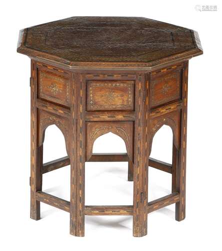 An Anglo-Indian hardwood octagonal occasional table, inlaid with brass and ebony with scrolling