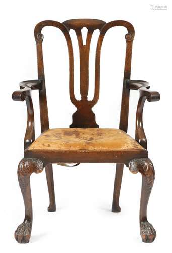 A mahogany open armchair in George II Irish style, with a pierced and scroll vase shaped splat back,