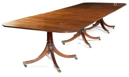 A mahogany triple pillar dining table in Regency style by William Tillman, the top with a reeded