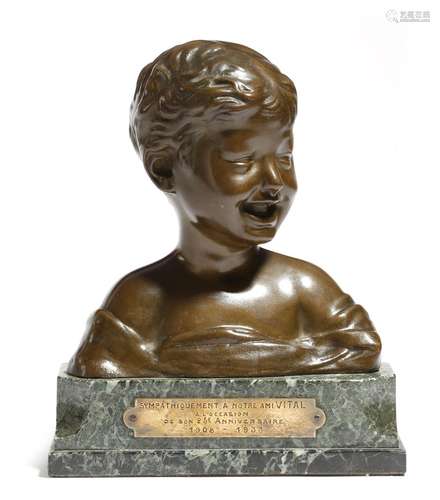 An early 20th century French bust of a boy, signed 'DONATELLO', on a green serpentine plinth with an