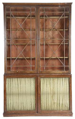 A near pair of late George III painted pine bookcases, each with a pair of astragal glazed doors,