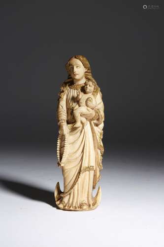 λ An Indo-Portuguese ivory group of the Virgin and child, with parcel gilt decoration and traces