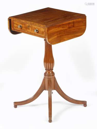 λ A Regency mahogany occasional table, inlaid with boxwood stringing, the drop-leaf top with