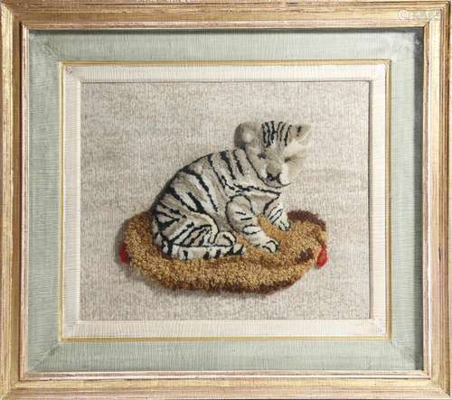 A 19th century wool and needlework picture of a cat, 20 x 25cm, later mounted in a painted and