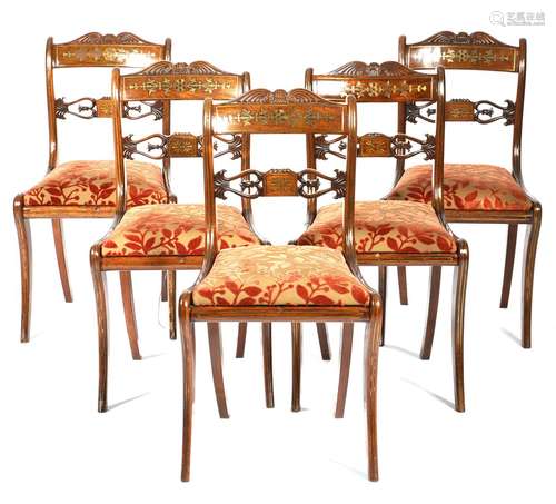 λ A matched set of six Regency rosewood and brass marquetry inlaid dining chairs, each with a scroll