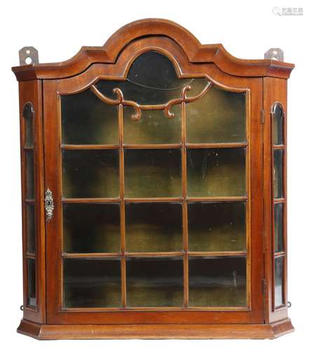 A 19th century Dutch walnut hanging wall cabinet, with an astragal glazed door enclosing three