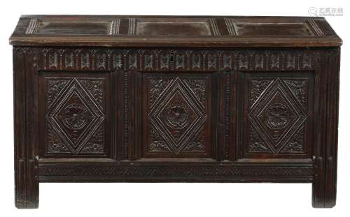 A 17th century oak triple panelled coffer, the interior originally with a till, the front with a