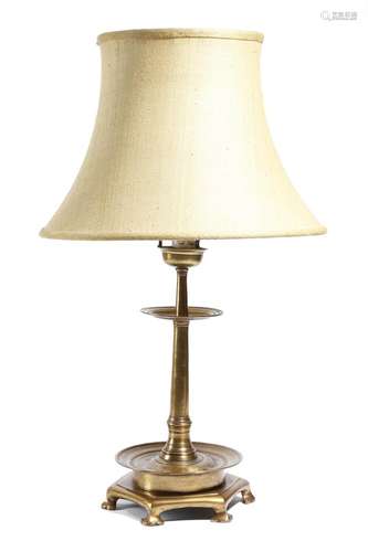 A brass altar style candlestick table lamp, the bowl top above two reeded drip-pans, on a