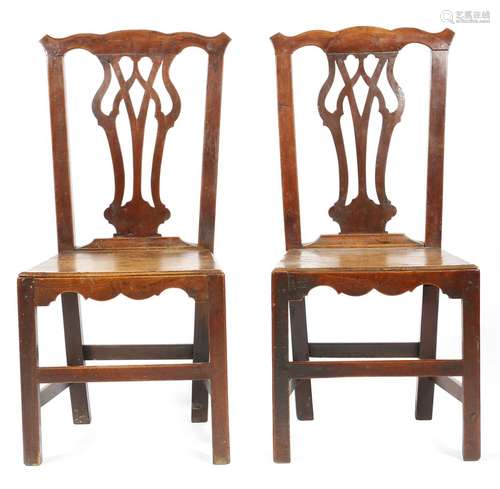 A pair of George III fruitwood country Chippendale style side chairs, each with a pierced splat,