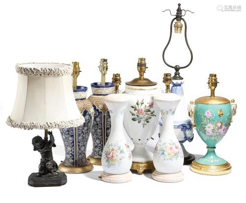 A collection of vase table lamps, including: a 19th century English bone china example, painted with