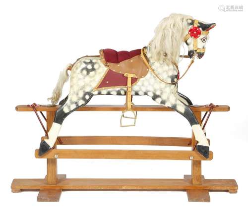 An Edwardian painted dappled grey rocking horse, on a wooden base, restored, early 20th century,