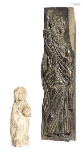 A Medieval style sandstone figure of a female saint, wearing a cloak and holding something in her