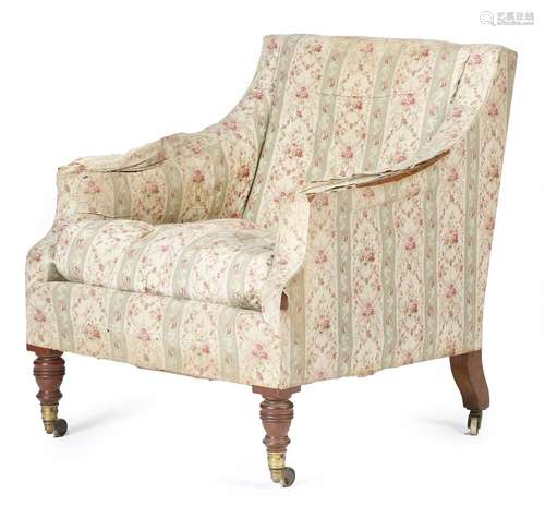 A late Victorian walnut armchair by Howard & Sons, covered in Howard floral ticking, on turned front