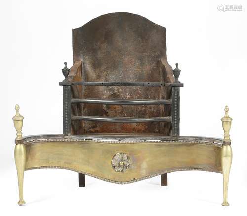 A cast iron and brass mounted fire-grate in George III style, the arched back above a railed