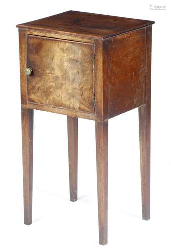 A George III mahogany bedside cupboard, with a hinged door, on square tapering legs, 74.1cm high,