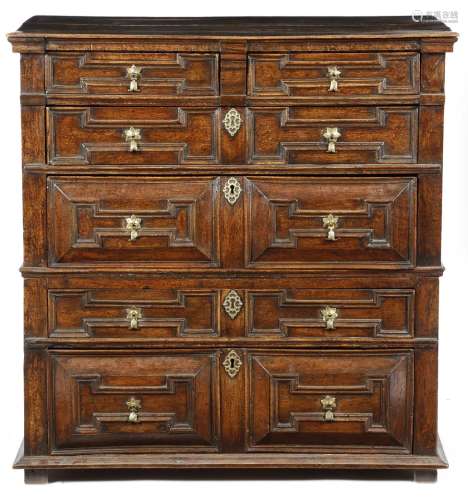 A Charles II oak chest, in two parts, with two short and four long geometric panelled front drawers,