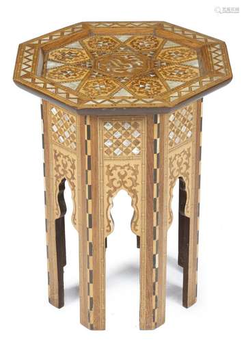 A Moorish walnut and marquetry octagonal occasional table, inlaid with mother of pearl and decorated