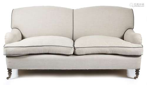 *A modern sofa in Howard & Sons style, covered in oatmeal fabric, on turned beechwood front legs and