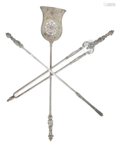 A set of William IV steel fire irons, with entwined dolphin and leaf handles and with a pierced pan,