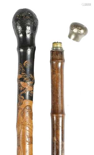 A novelty walking cane by Briggs, the handle with a screw-off cap revealing a candle holder, stamped