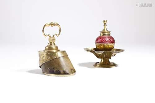 A gilt brass mounted hoof paperweight, with a swing handle, together with a Victorian brass and