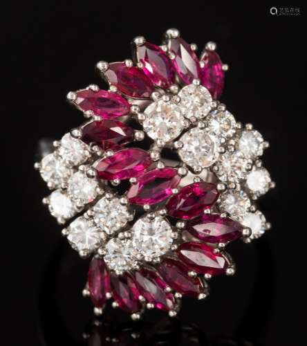 A ruby and diamond ballerina cluster ring: with fifteen marquise-shaped rubies and seventeen