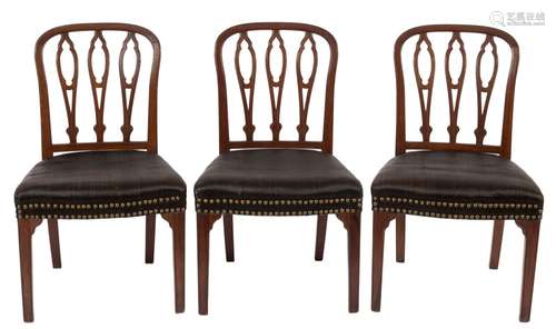 A set of five George III mahogany dining chairs in the Hepplewhite taste:,