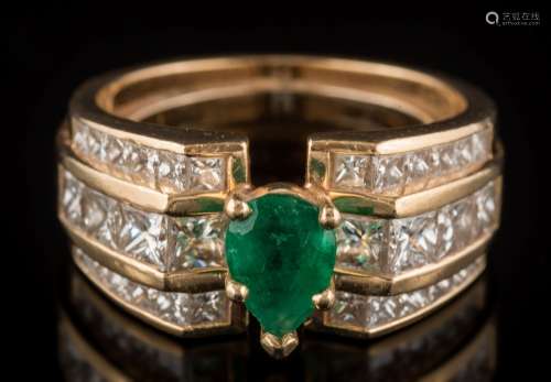 An emerald and diamond mounted ring: with central pear-shaped emerald claw-set between bands of