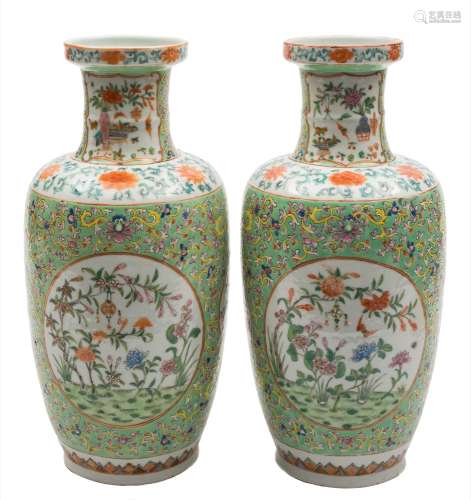 A pair of Chinese famille rose baluster vases: each painted with panels of auspicious objects, bats,