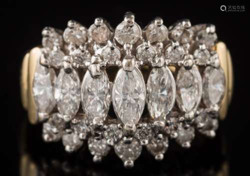 A diamond cluster ring: with central row of graduated,