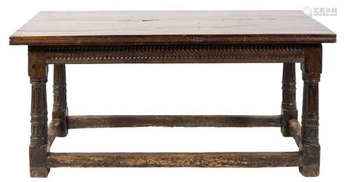 A 17th century oak dining table of refectory type:, with an adapted plank top,